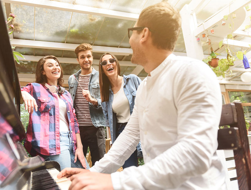 Adult playing piano with confidence and joy